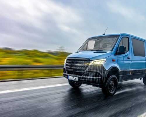 blue-delivery-van-wet-highway-with-motion-blur-shipping-motion_169016-69815