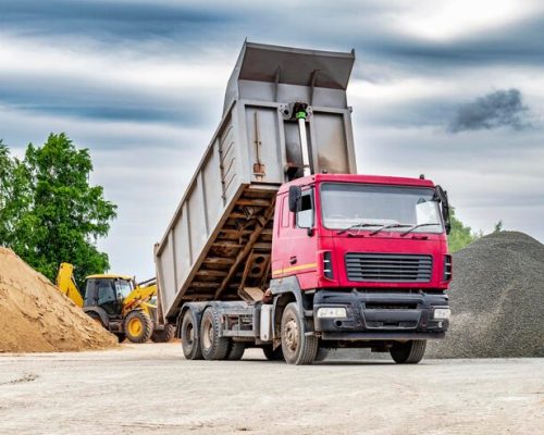 dump-truck-with-raised-body-construction-site-transportation-unloading-sand-soil-technique-transportation-bulk-materials-transportation-bulk-building-materials_331695-8715